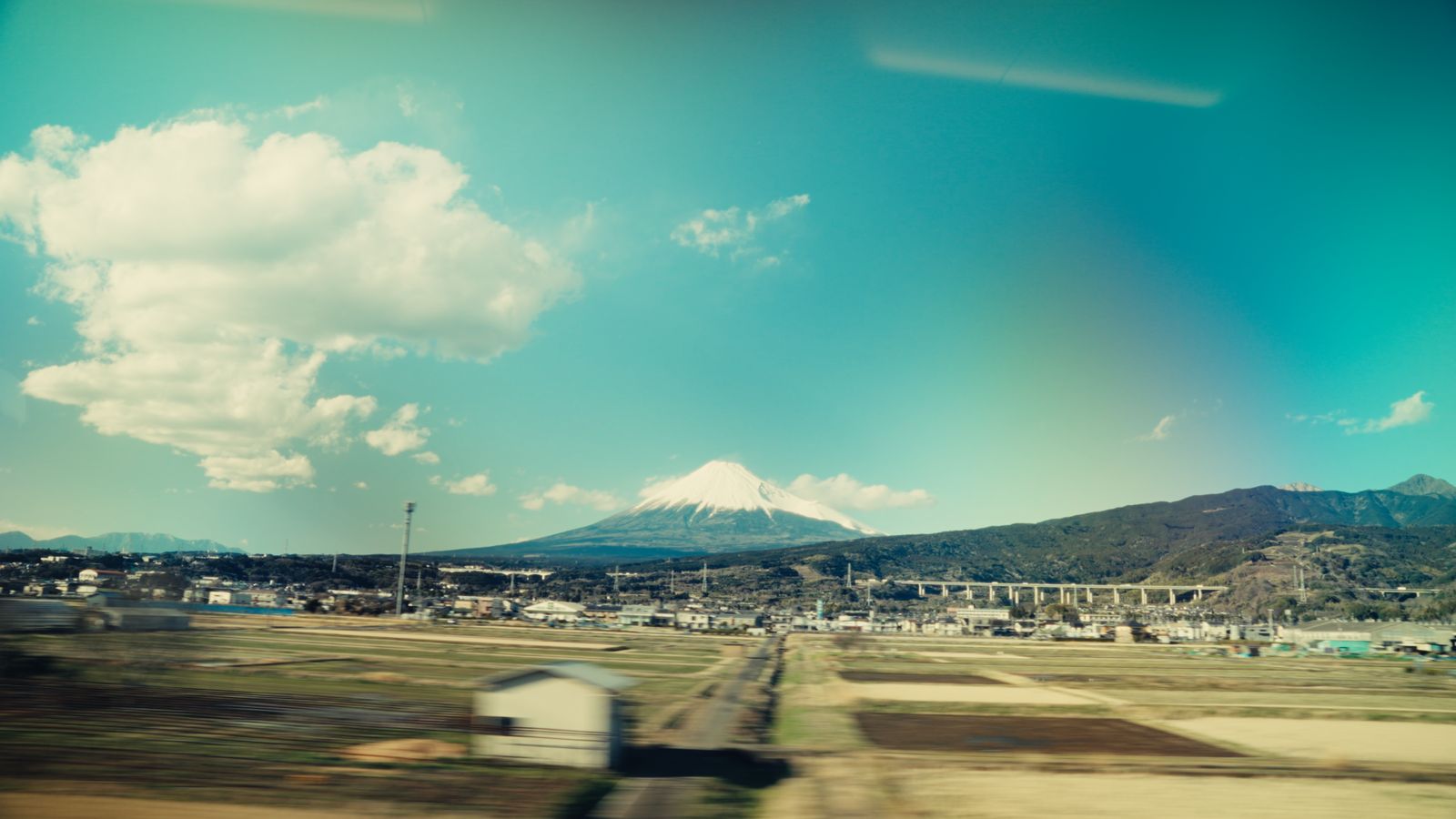 Mount Fuji seen from a moving train