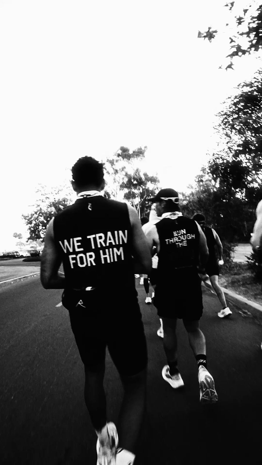 Runners on the road at dusk, from the Never Surrender series