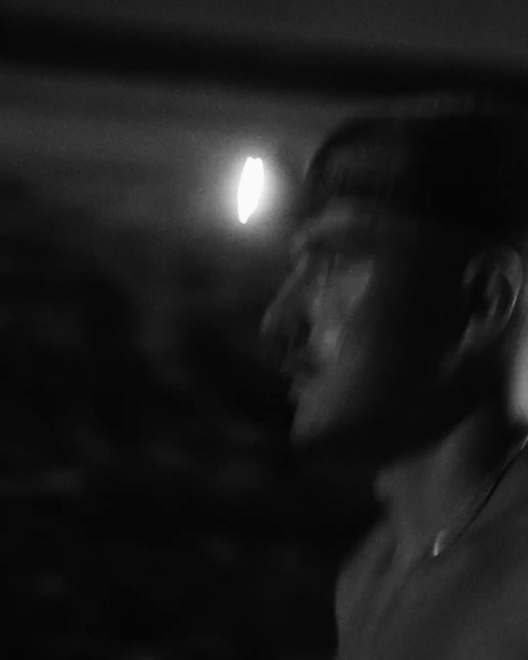 Black-and-white portrait of an athlete in a cap, from the Never Surrender athlete series