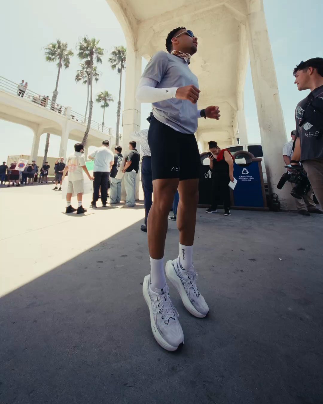 A runner under the pier in Oceanside, from Project 100